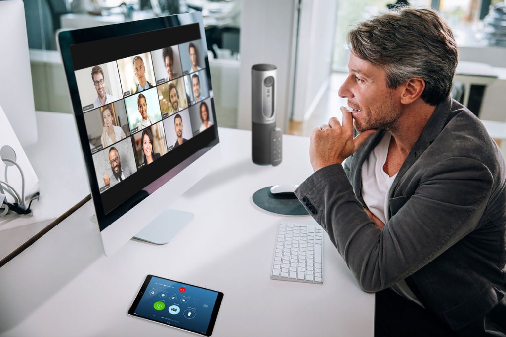 Man on an online reunion group call with friends 